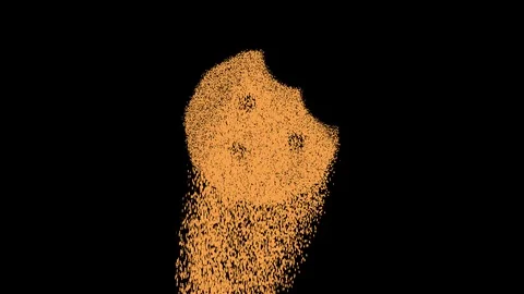 Symbol cookie bite appears from crumbling sand. Then crumbles down. Alpha Stock Footage 106523091