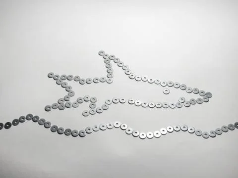The symbol of the fish on waves. handmade Stock Photos