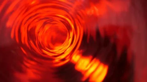 Symbol of hell, inferno and infinity. Red liquid hypnotic looped aqua swirl t Stock Photos