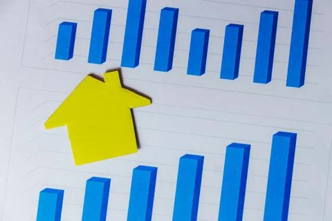 Symbol of House on White Background with Graphs. Concept of Housing Cost. Stock Photos