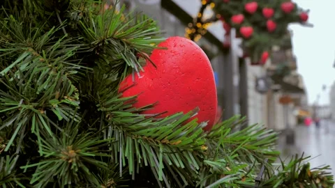 Symbol of love sways on a tree when a light breeze blows Stock Footage 300901240