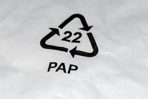 Symbol of paper recycling code on white paper close-up Stock Photos