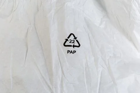 Symbol with recycling code on slightly crumpled white paper Stock Photos