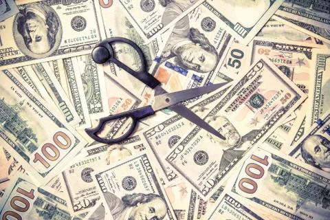 Symbol of the sequester of the budget on the background of the American currency Stock Photos