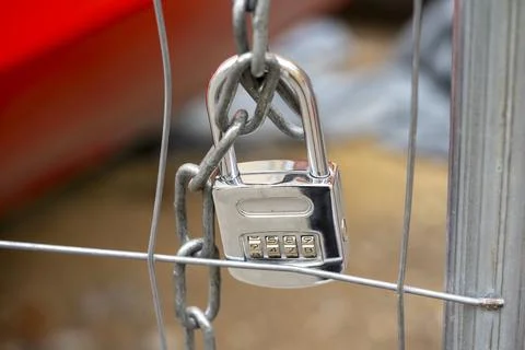 Symbolic code lock on a fence Stock Photos