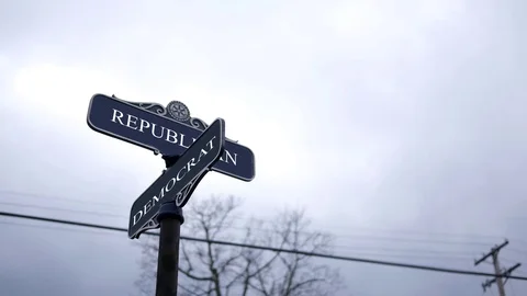 Symbolic crossroads typography with dark sky -  Republican and Democrat Stock Footage