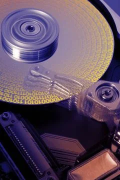 Symbolic data processing studio photography of a opened hard disk at work ... Stockfoto's