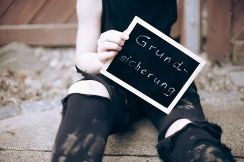 Symbolic image Child basic security child poverty child in torn and dirty Stock Photos