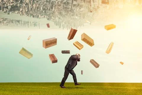 Symbolic problems falling on a man on a grassy lawn Stock Photos