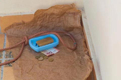 Symbolic scene, solid soap, gallows loop, euro coins, 10 euro banknote. Hope 스톡 사진