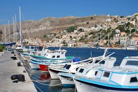 SYMI, GREECE - 06/17/2011: Yialos harbour Stock Photos