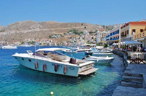 SYMI, GREECE - 06/26/2011: Yialos harbour Stock Photos