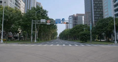 Symmetric shot of empty street crossing in Taipei, Taiwan on a sunny day Stock Footage