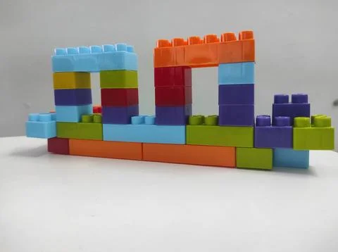 Symmetrical arch structure built from toy bricks Stock Photos