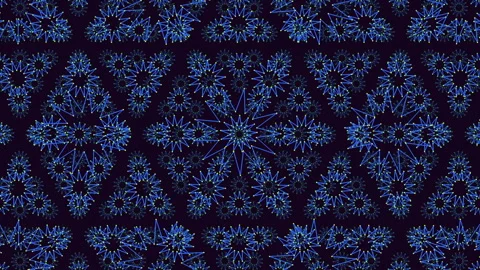 Symmetrical blue floral pattern on black background Stock-Footage 322757526