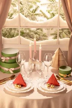 Symmetrical Christmas Table Setting for Two with Lit Taper Candles Stock Photos