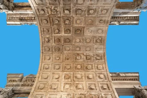 The symmetrical coffered ceiling pattern of the ancient Roman arch structur.. Stock Photos