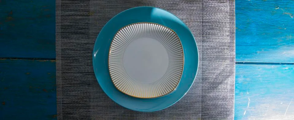 Symmetrical composition of two empty dishes on a gray background zenith view Stock Photos