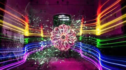 Symmetrical flower-like pattern of pink and red light trails with multicolo.. 스톡 사진