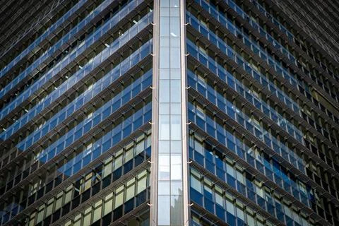 Symmetrical geometric pattern, facade of a modern business building. Stock Photos