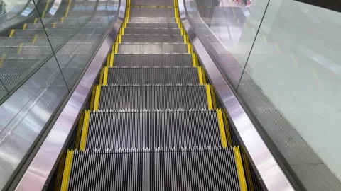 Symmetrical high angle view of empty moving escalator Stock Footage 332092586
