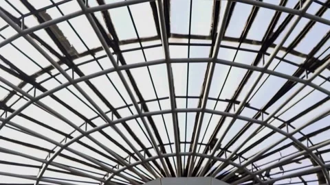 Symmetrical low angle view of the glass panel roof structure at the Opera Stockbeeldmateriaal 277464308