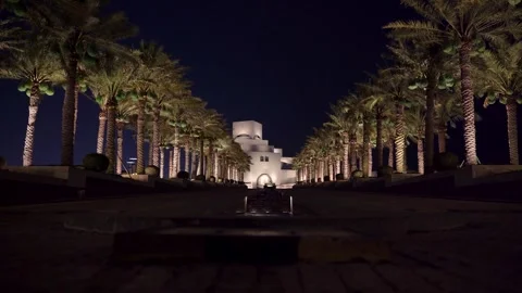 Symmetrical Night View of Museum of Islamic Art and Palm Tree Avenue in Doha Stock Footage 337036528