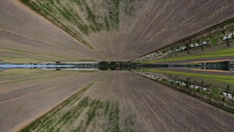 Symmetrical path reflects calm water surface Видео 345396975