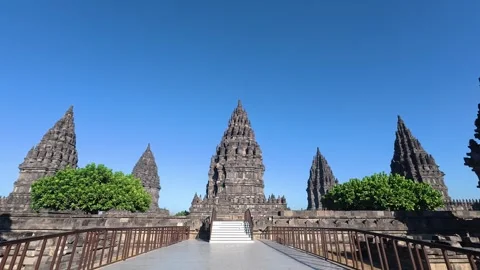Symmetrical pathway leads toward the towering Prambanan Temple complex thro.. Stock Footage 341542543