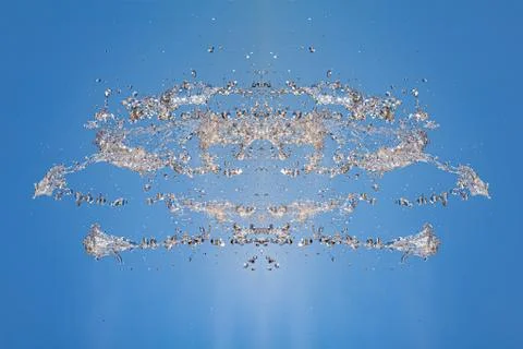 Symmetrical pattern of stopped water droplets with transparent streams on a b Stock Photos