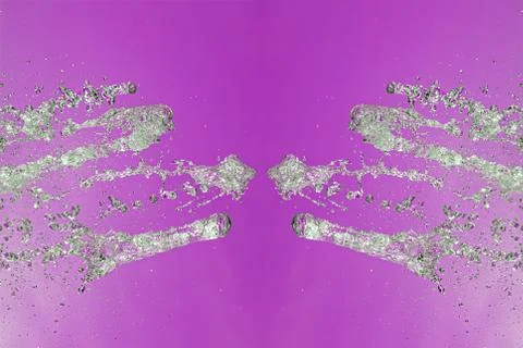 Symmetrical pattern of stopped water droplets with transparent streams on a p Stock Photos