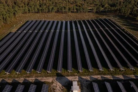 Symmetrical photovoltaic solar panel array captured by drone Photos