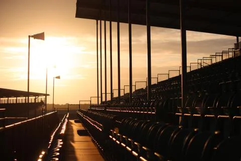 Symmetrical regular pattern grandstand seating arrangement at sunset Stock Photos