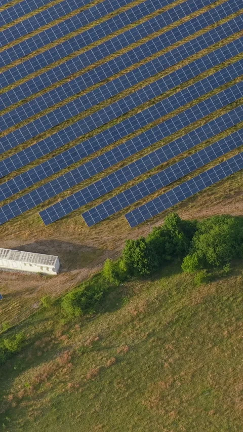 Symmetrical Rows Of Blue Solar Panels And A Battery Container Over Dry Flat.. Stock Footage 338995055