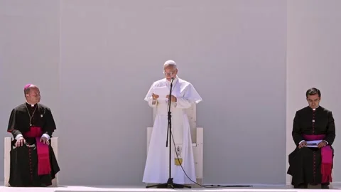 Symmetrical Shot of Pope Reading with Bishop and Companion on Stage in Tenerife Stock Footage 343459048