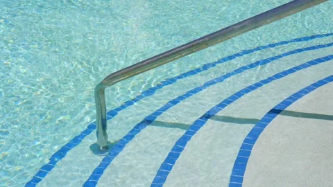 Symmetrical steps made of blue tiles and shiny stainless railing organizing Stock Footage 247260497