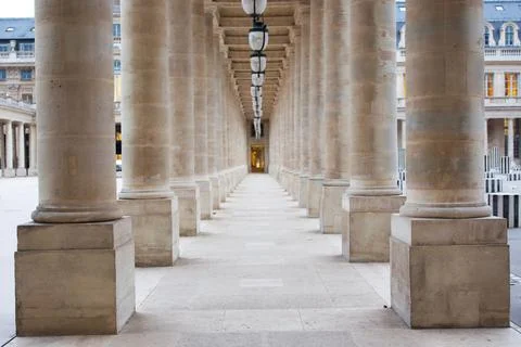 Symmetrical Stone Columns in Palais Royal Creating a Sense of Depth and Grandeur Stock Photos