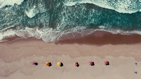 Symmetrical umbrellas at the beach Stock Footage 307316455