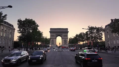 Symmetrical view of Arc de Triomphe during golden evening in Paris Stock Footage 339916231