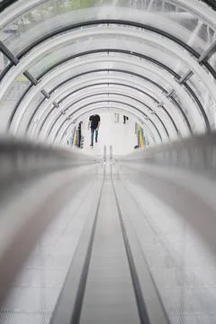 Symmetrical View Between Two Escalators Used By the Public Stock Photos