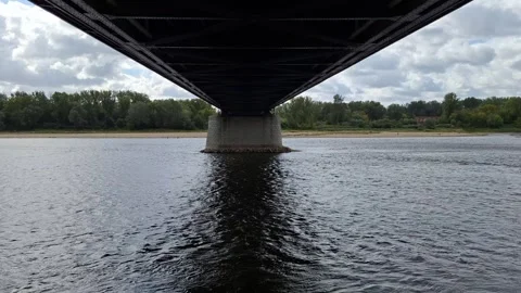 Symmetrical View of a Bridge from Below Over a Dark River 스톡 동영상 344847752