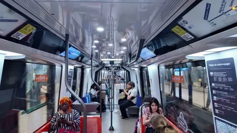 Symmetrical view inside modern Paris Metro train with passengers Stock-Footage 339226408