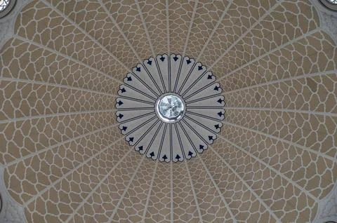 Symmetrical view of mosque doom inside Islamic architecture Stock Photos