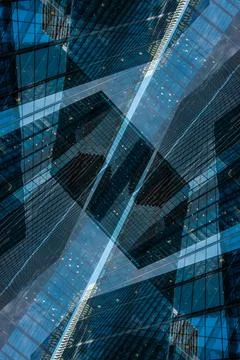Symmetry and mirrored geometry pattern, reflected skyscrapers and modern Stock Photos