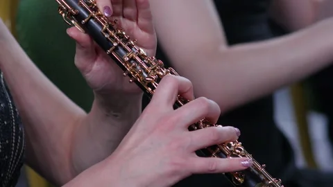 Symphony orchestra brass section. Close up hands of oboist playing.  Stock Footage 277829936