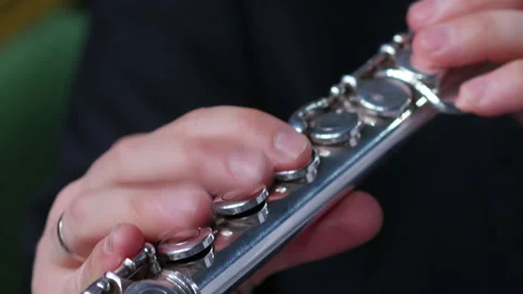 Symphony orchestra brass section. Close up hands of flute player Stock Footage 277830469