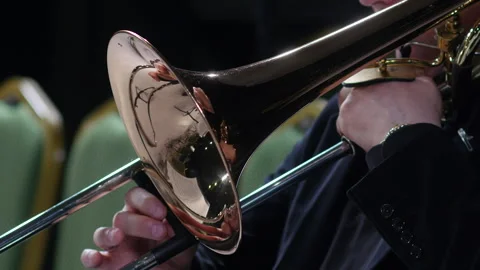 Symphony orchestra brass section. Trombone player close up Stock Footage 277833893