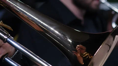 Symphony orchestra brass section. Trombone player close up Stock Footage 277834084