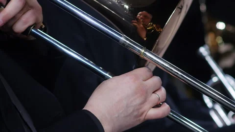 Symphony orchestra brass section. Trombone player close up Stock Footage 277834257