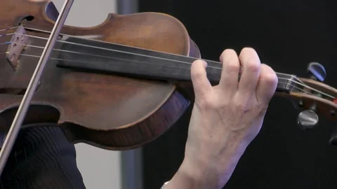 Symphony orchestra the musician's hands play a bow on the violin. Stock Footage 155003407